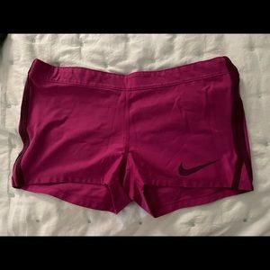 Magenta colored Nike running shorts size large